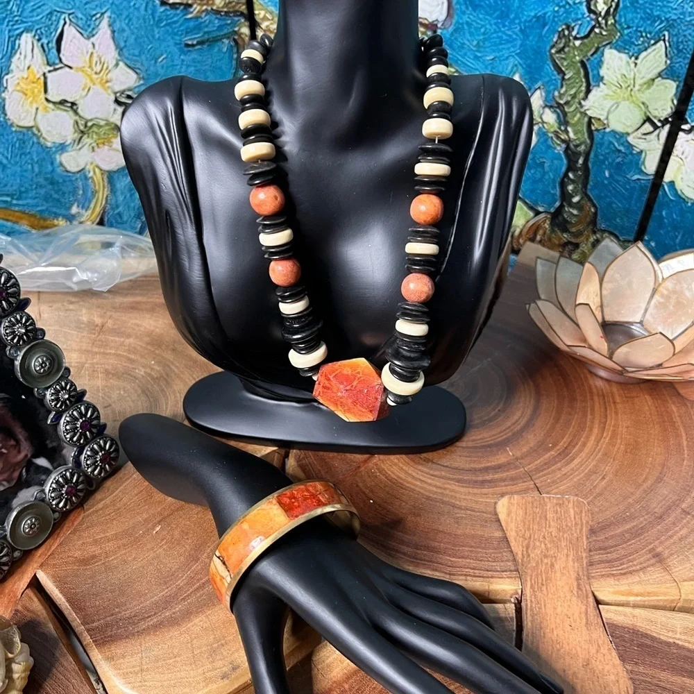 Three piece, rust and black stone and beaded costume jewelry.
